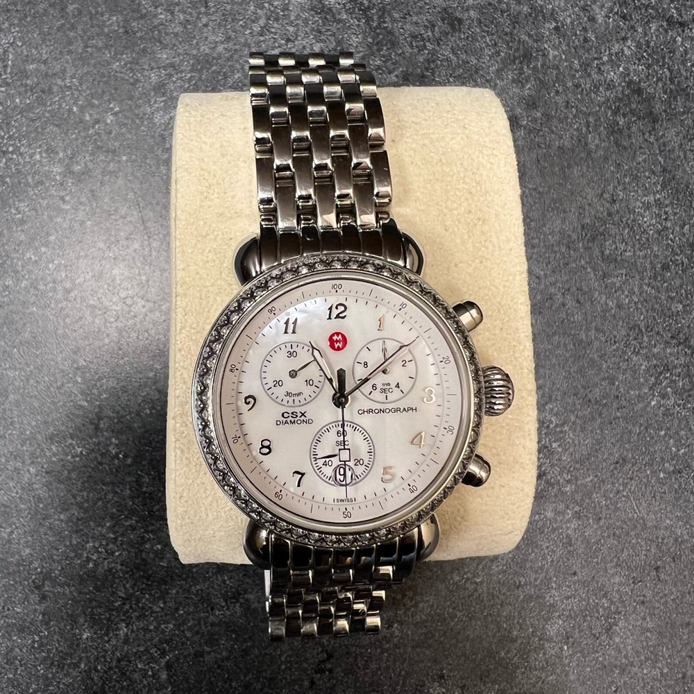 White gold round face Michele watch with diamond bezel